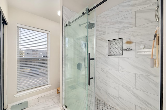 full bath featuring marble finish floor and a shower stall