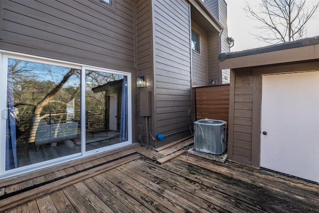 wooden terrace featuring central air condition unit