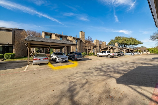 view of partially covered parking lot