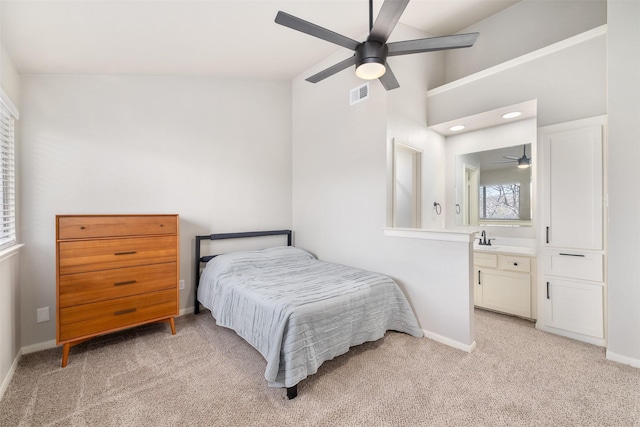 bedroom with visible vents, light carpet, and baseboards