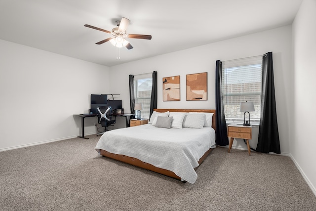 bedroom with ceiling fan, carpet floors, and baseboards