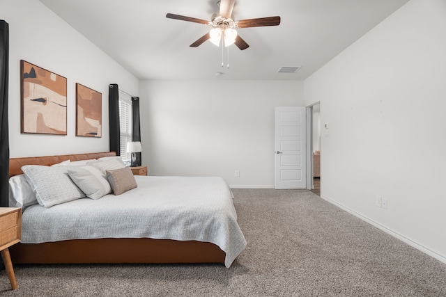 bedroom featuring ceiling fan, carpet, visible vents, and baseboards