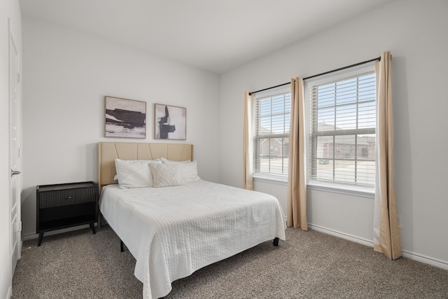 bedroom with carpet and baseboards