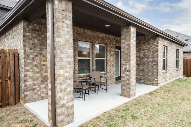 view of patio / terrace featuring fence