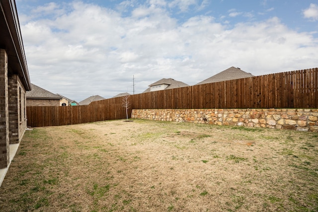 view of yard featuring a fenced backyard