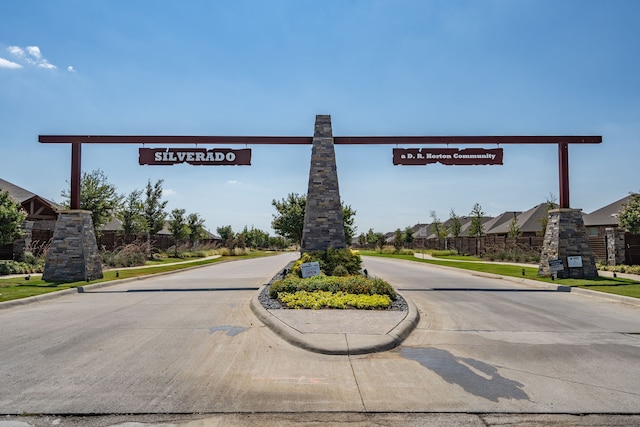 view of street featuring a residential view and curbs