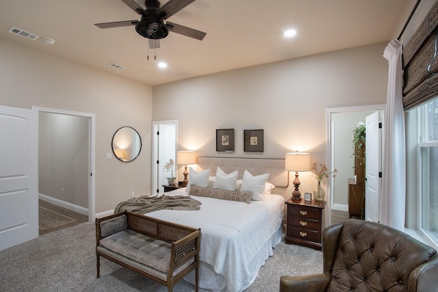 carpeted bedroom with recessed lighting, visible vents, and baseboards