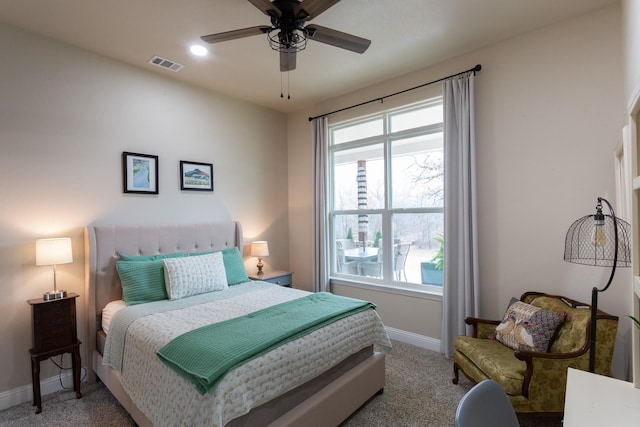 bedroom with carpet floors, baseboards, visible vents, and ceiling fan