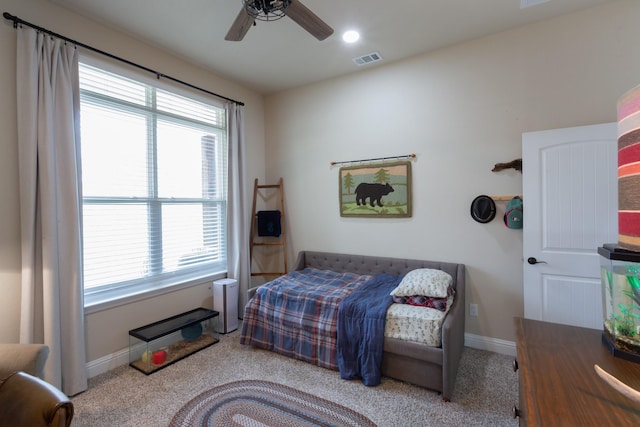 bedroom featuring carpet, baseboards, visible vents, and ceiling fan