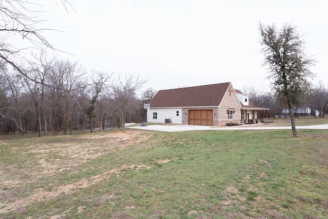 exterior space with a garage and a yard