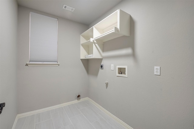 laundry area with laundry area, visible vents, gas dryer hookup, hookup for a washing machine, and hookup for an electric dryer