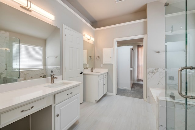 bathroom featuring a tub to relax in, two vanities, a sink, and a marble finish shower