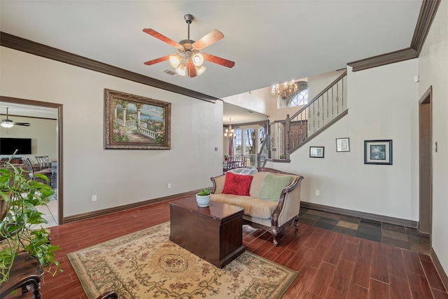 living room with crown molding, stairway, wood finished floors, baseboards, and ceiling fan with notable chandelier