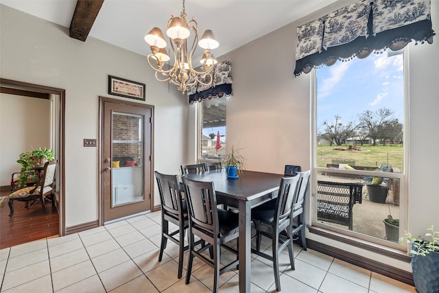 dining area with light tile patterned floors, baseboards, beam ceiling, and a notable chandelier