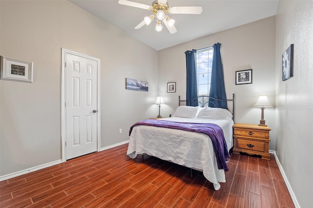 bedroom featuring wood finish floors, a ceiling fan, and baseboards