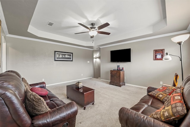 carpeted living room featuring ceiling fan, baseboards, and a raised ceiling