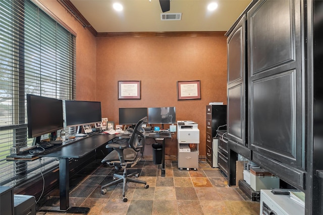 office space with stone finish floor, visible vents, and crown molding