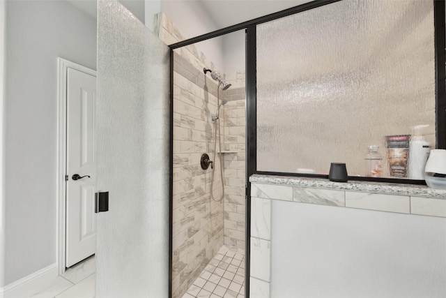 full bath with marble finish floor and a stall shower