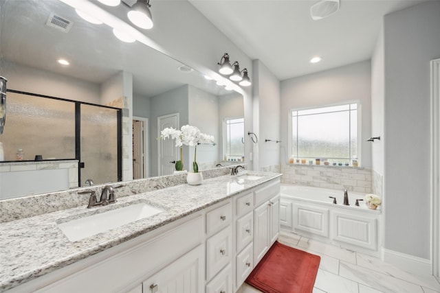 full bath featuring a garden tub, double vanity, a stall shower, and a sink