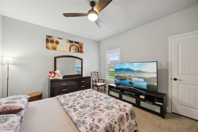 bedroom with ceiling fan and light colored carpet