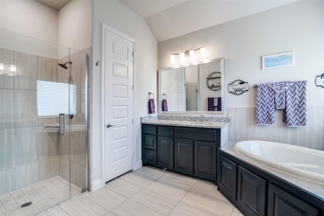 bathroom featuring a garden tub, a shower stall, and vanity