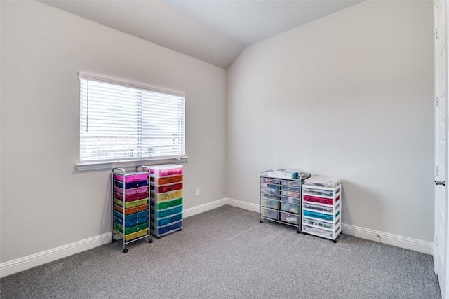 misc room featuring carpet flooring, vaulted ceiling, and baseboards