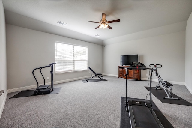 exercise room featuring carpet flooring, visible vents, and baseboards