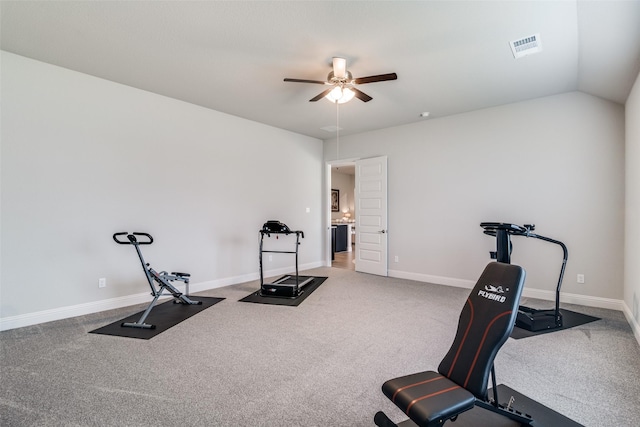 exercise area featuring carpet flooring, ceiling fan, visible vents, and baseboards