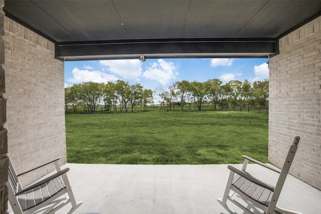 view of yard featuring fence and a patio