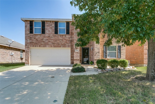 traditional-style house featuring an attached garage, concrete driveway, brick siding, and a front yard