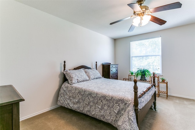 bedroom featuring carpet, baseboards, and a ceiling fan