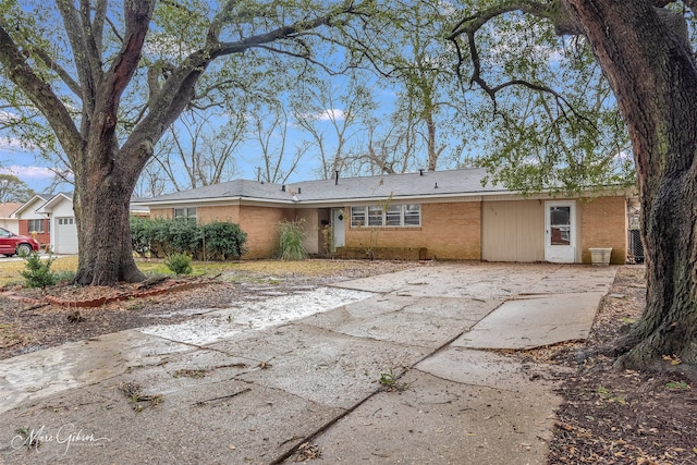 rear view of property featuring brick siding