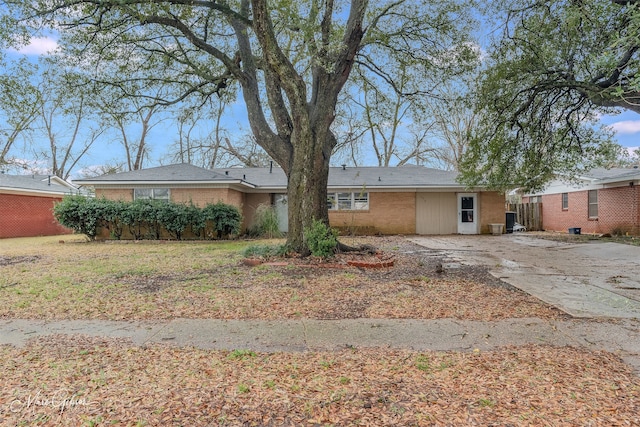 ranch-style house with brick siding