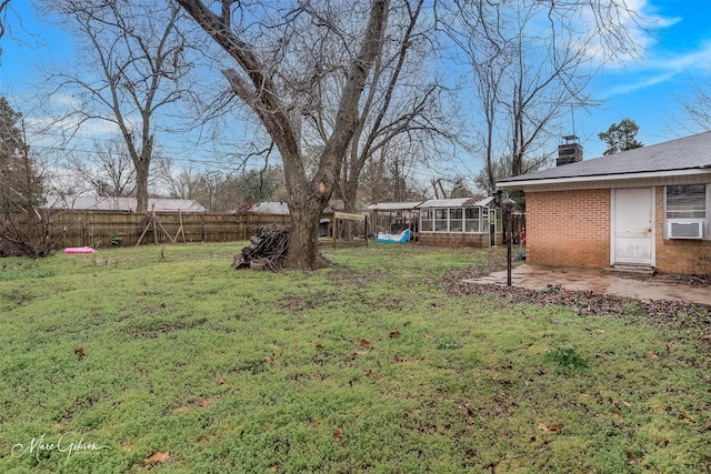 view of yard with a fenced backyard and cooling unit