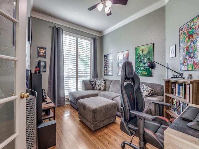 office area with ceiling fan, crown molding, and wood finished floors