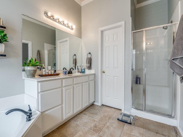 bathroom featuring a garden tub, crown molding, double vanity, a sink, and a shower stall