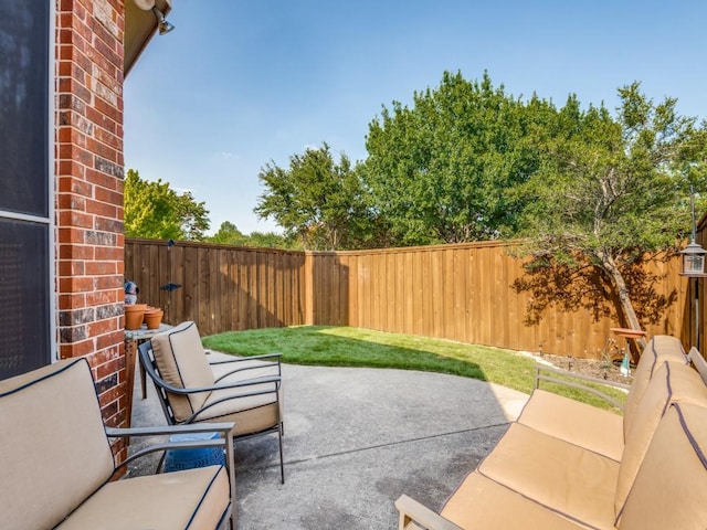 view of patio with a fenced backyard and outdoor lounge area