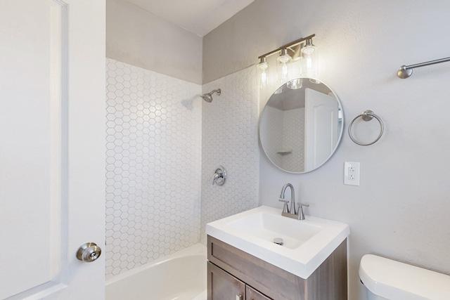 bathroom featuring  shower combination, vanity, and toilet