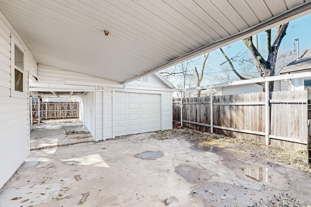 garage with fence