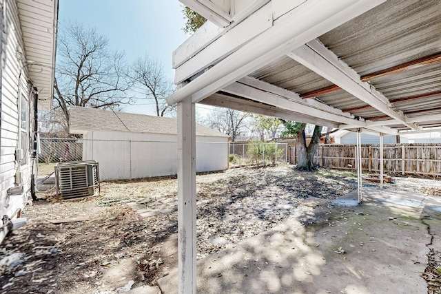 view of yard featuring central air condition unit and a fenced backyard