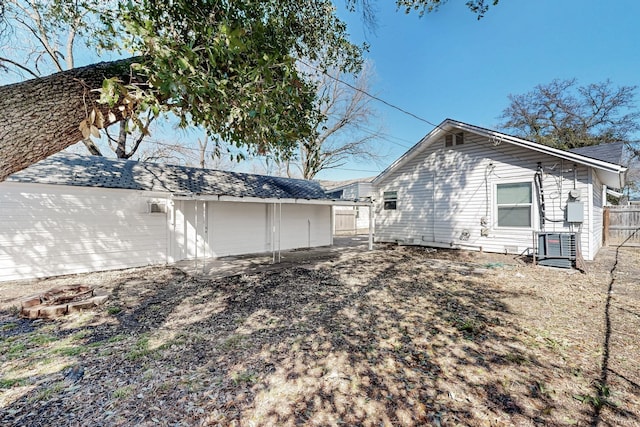 view of side of property featuring fence