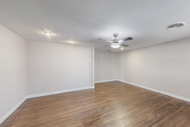 unfurnished room featuring visible vents, ceiling fan, baseboards, and wood finished floors