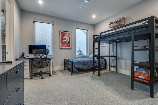 bedroom with recessed lighting, light colored carpet, and baseboards