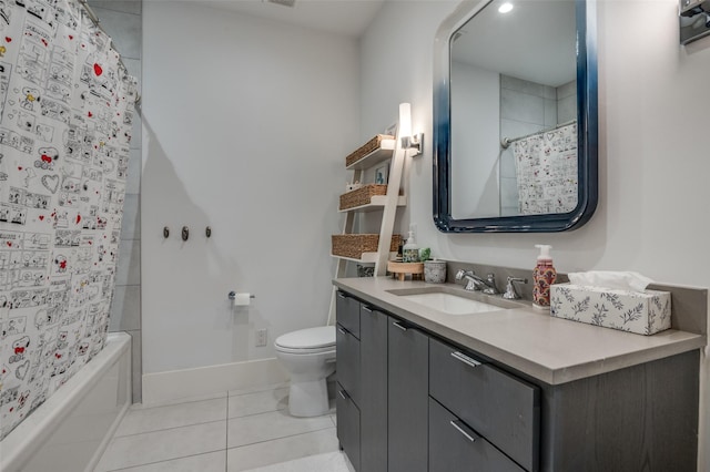 bathroom with toilet, vanity, baseboards, tile patterned floors, and shower / bathtub combination with curtain