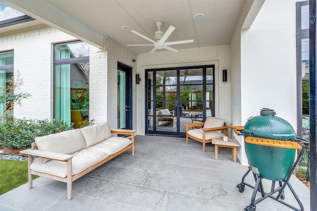 view of patio / terrace featuring ceiling fan and french doors