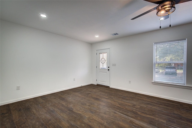 unfurnished room featuring recessed lighting, visible vents, dark wood-type flooring, a ceiling fan, and baseboards