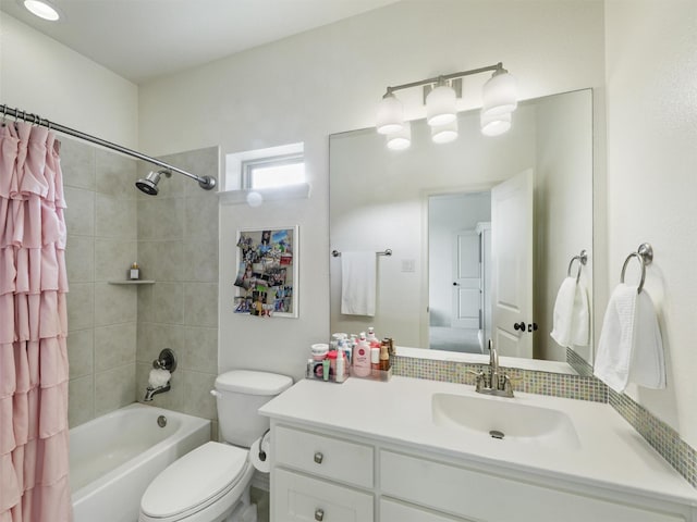 full bathroom featuring toilet, vanity, and shower / tub combo with curtain