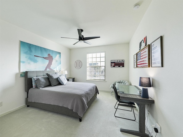 carpeted bedroom featuring ceiling fan and baseboards