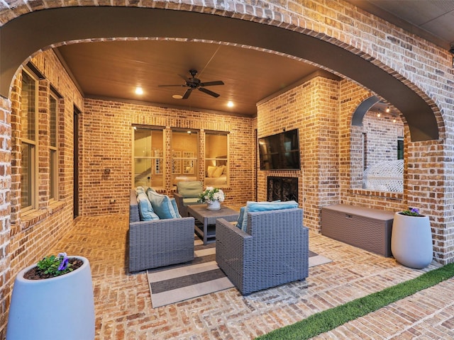 view of patio / terrace featuring a ceiling fan and an outdoor living space