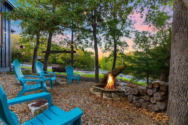 view of property's community with an outdoor fire pit